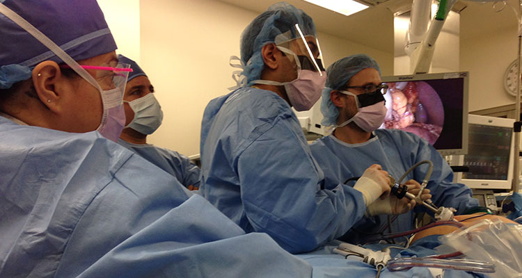 Residents perform surgery