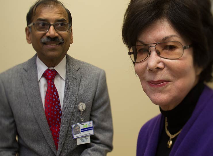 Doctor sitting next to patient