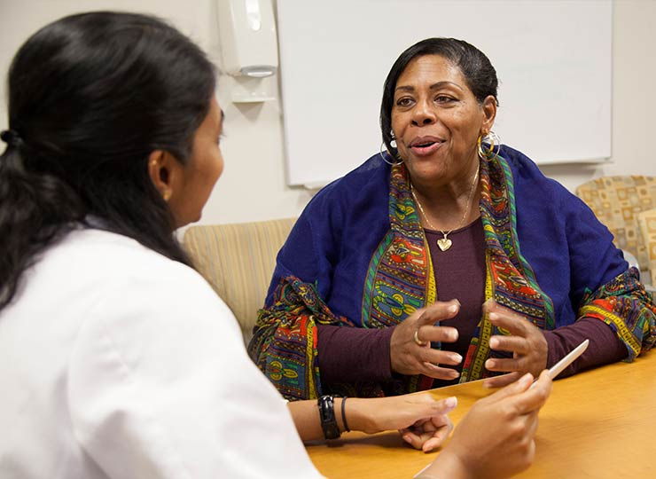 Female patient talking to doctor