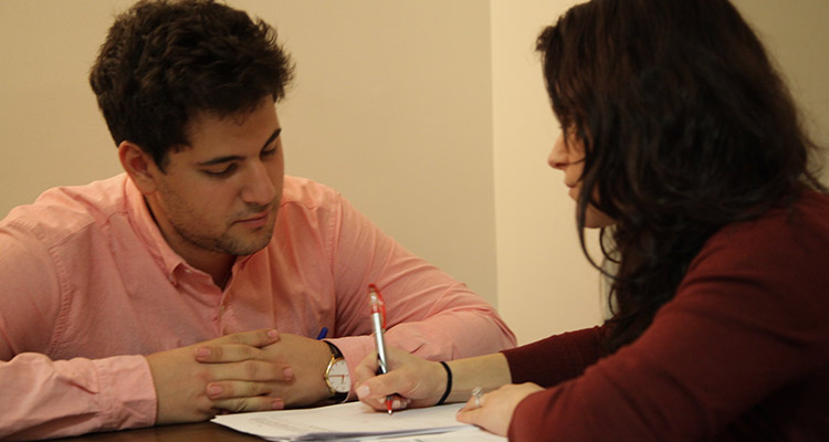 Man and woman look over documents